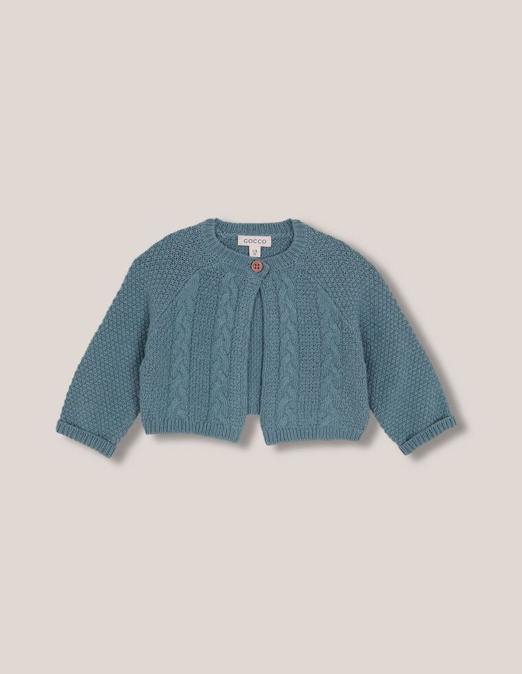 Veste bleu clair à manches raglan et torsades