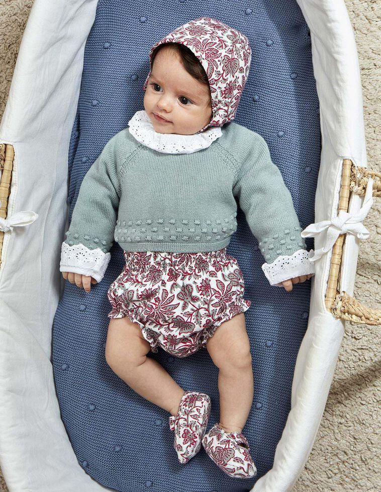 Pull avec laine et détails en maille bobo et pompons verts