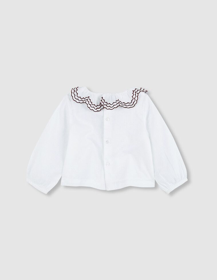 Chemise blanche à col volanté brodé
