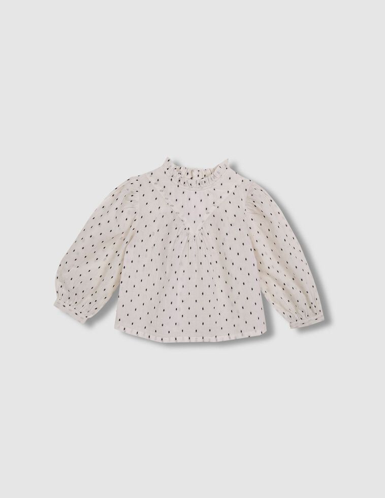 Blouse blanche à plumetis noirs