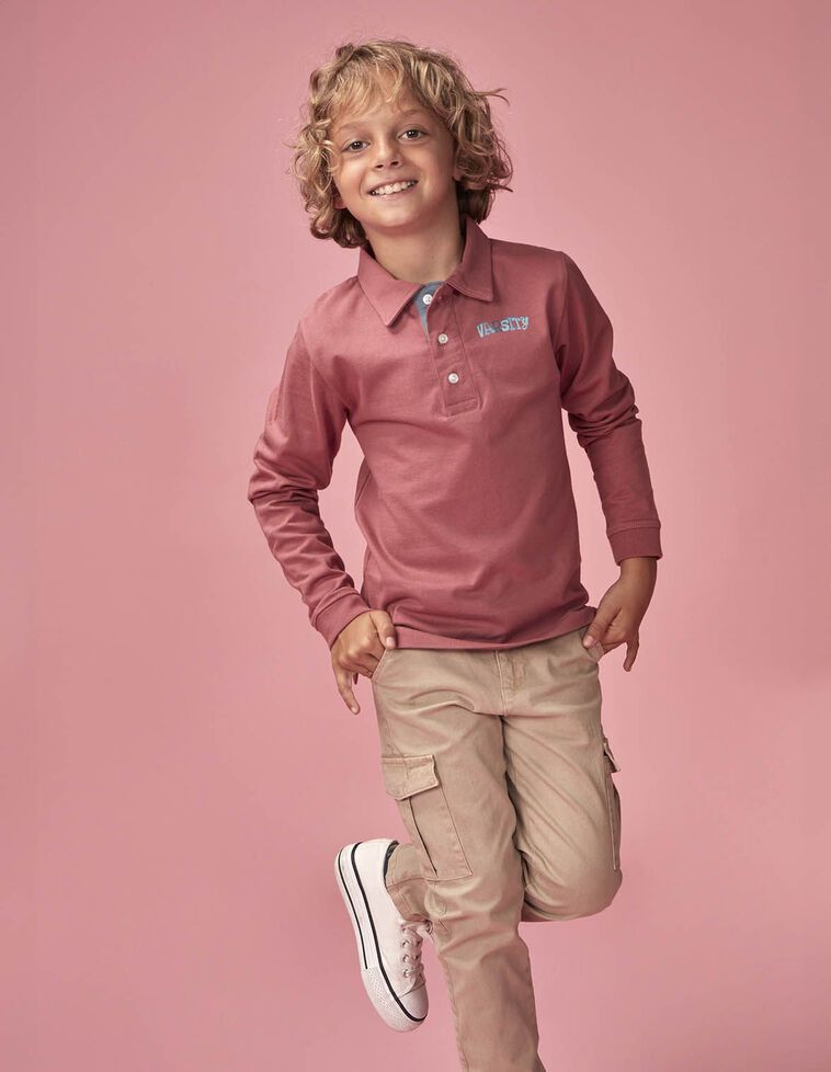 Polo uni avec motif rose dans le dos