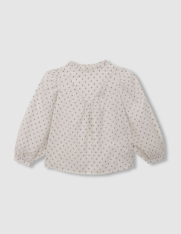 Blouse blanche à plumetis noirs