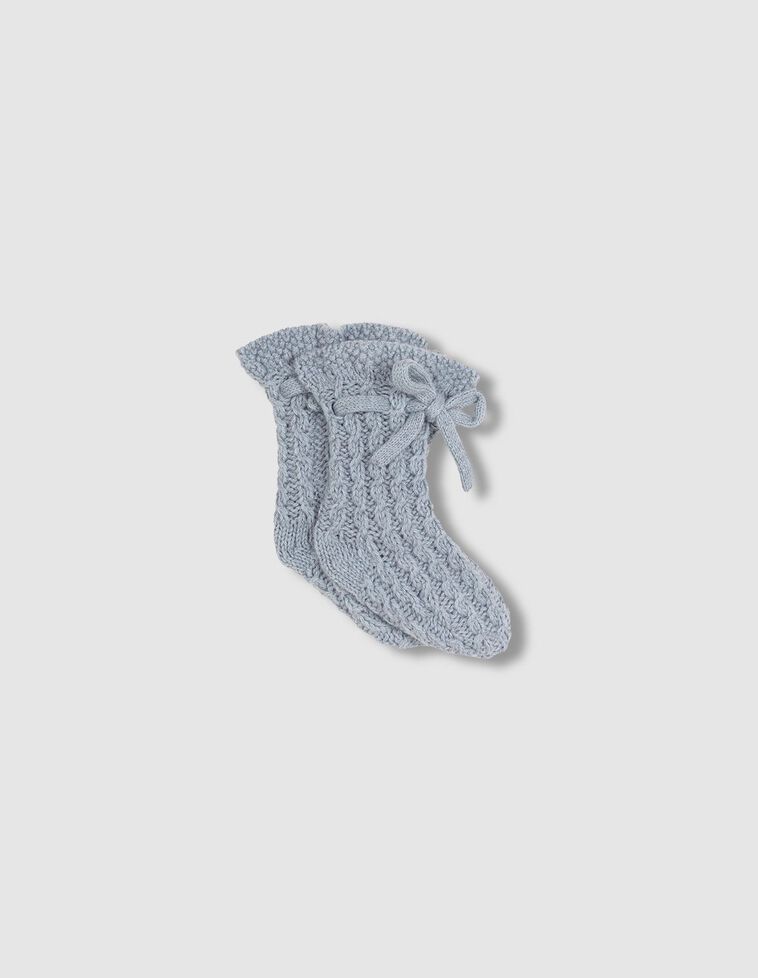 Chaussons en tricot avec laine et torsades bleues