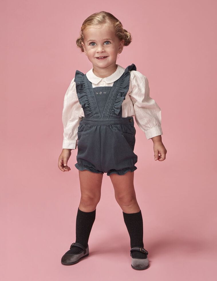 Salopette courte à rayures et volants bleu clair